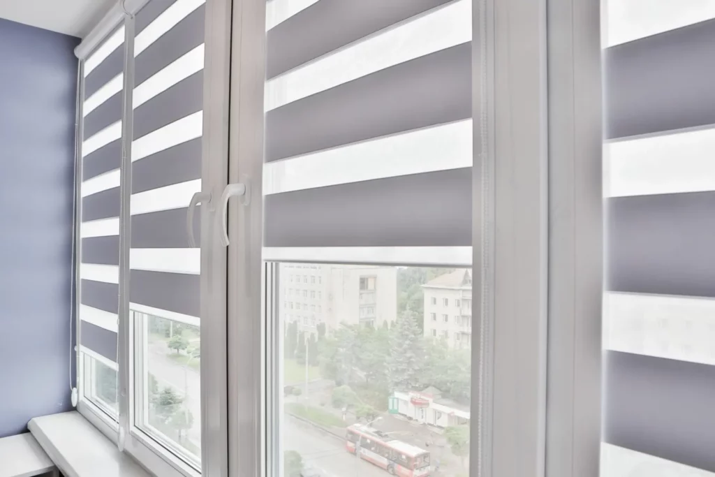 AdobeStock_364834975 Ellegant set of white zebra blinds with revolving mechanism