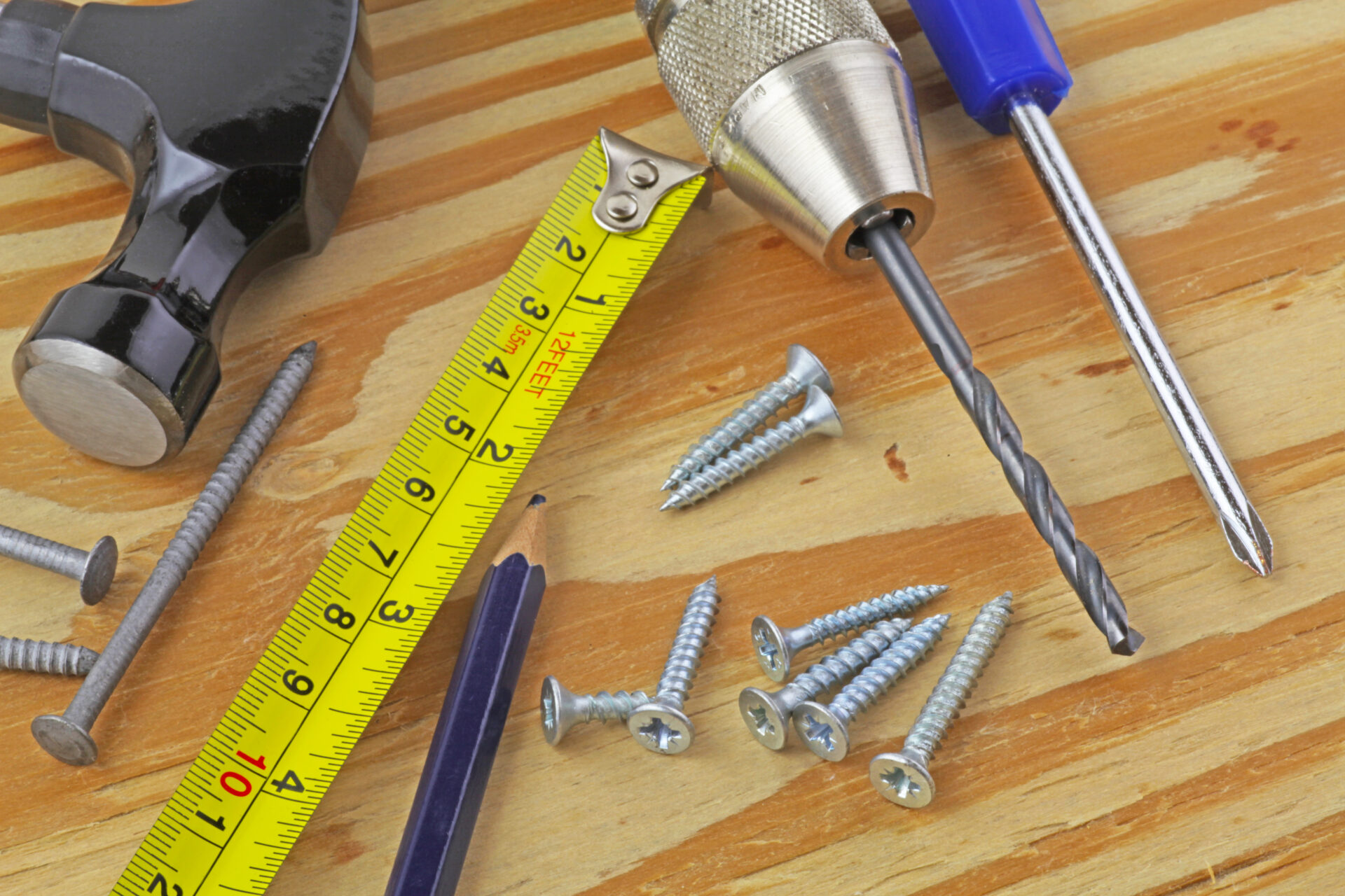 Tools for installing window blind. Hammer, tape measure, screws, drills. Wholesale Blind Factory