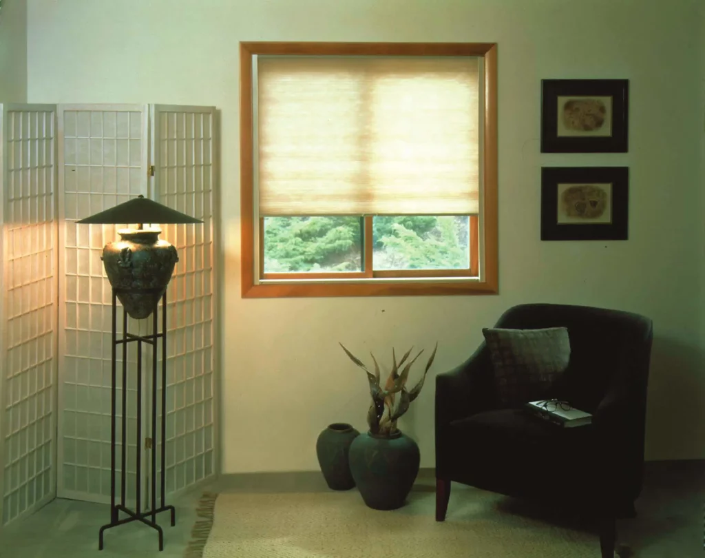 Honeycomb_053-opti A small window in an Asian themed room, covered by beige cellular shades giving the room a traditional vibe.