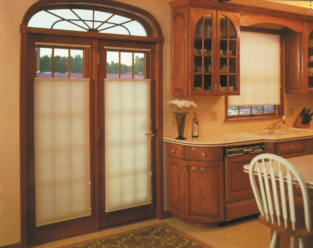 Wholesale-Blind-Factory-Shades-Cellular-Shades_AE-opti Cellular window blinds cover a kitchen's windows